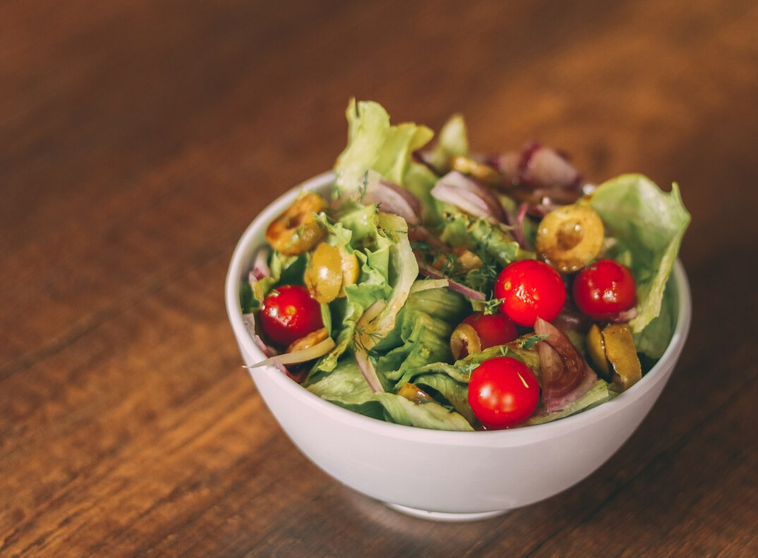 Fresh salad bowl with vegetables and greens