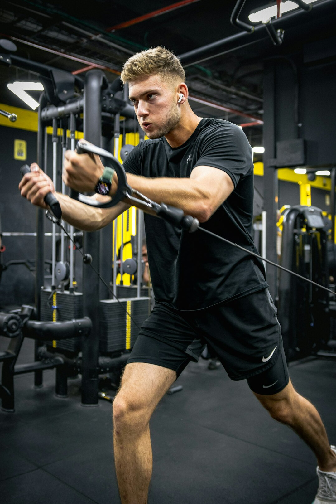 Man exercising in a bright gym