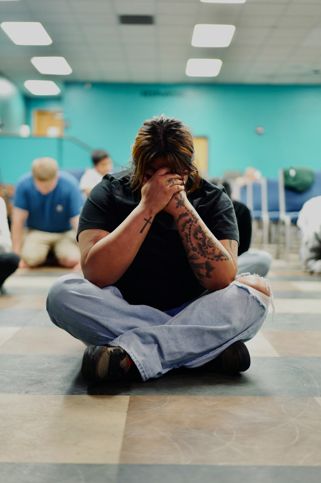 person meditating in class